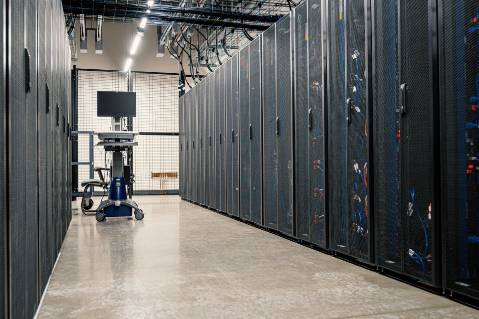 Rows of server racks in a data center.